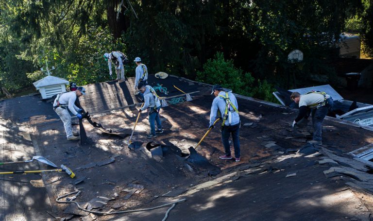 Crew removing old roof