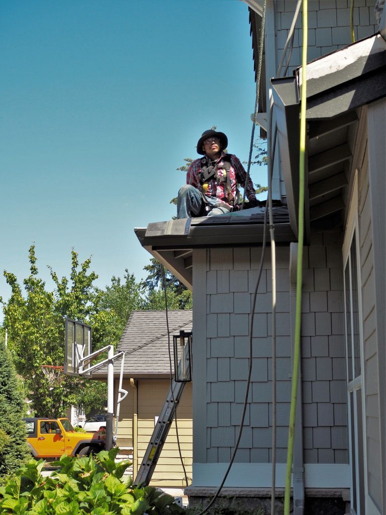 Crew member on roof edge