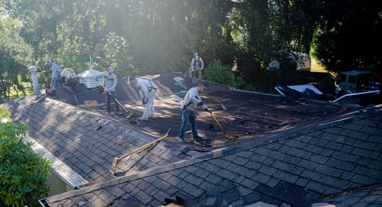 Crew Removing Roof Material