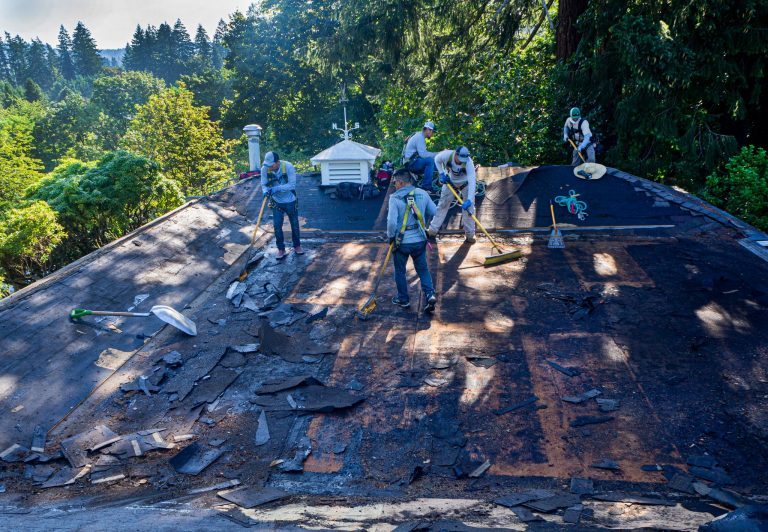Crew removing shingles