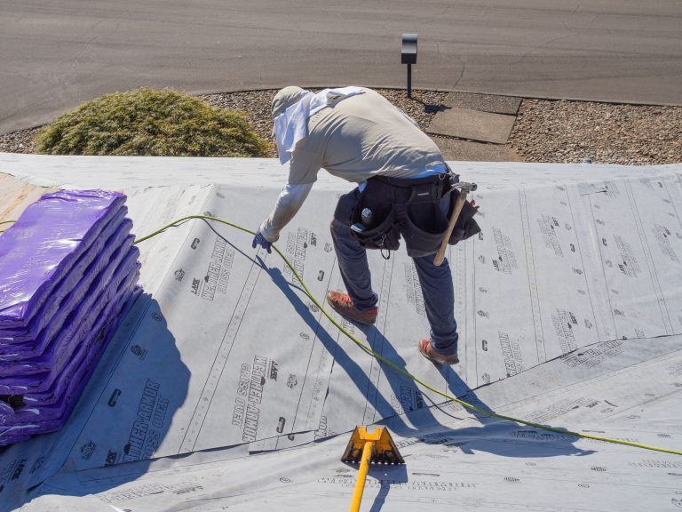 Cherry Roofing crewmen hard at work on a roof.