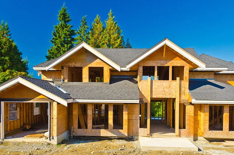 New construction home with roofing underway in the Pacific Northwest—highlighting proper roofing installation during residential build.