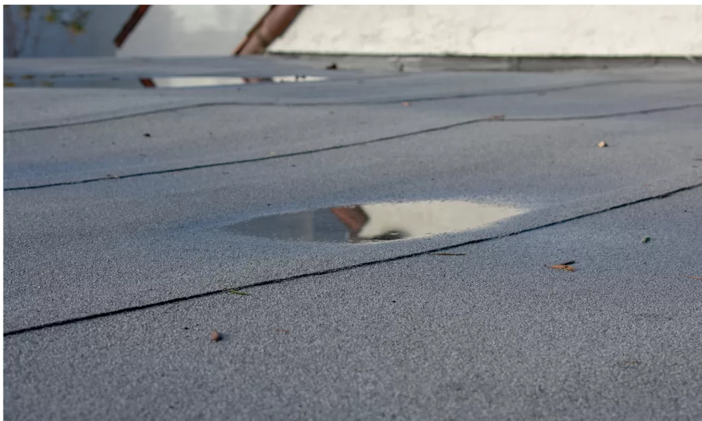 Flat roof showing signs of water pooling—highlighting the need for flat roof replacement by Cherry Roofing in Vancouver, WA.